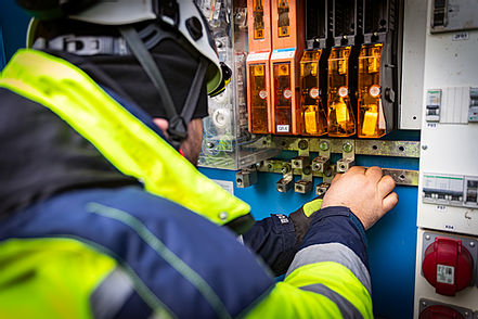 Electrician working on a panel