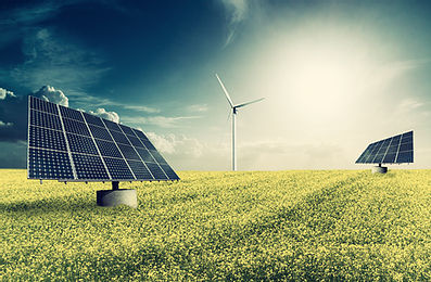 solar panels in field with wind turbine